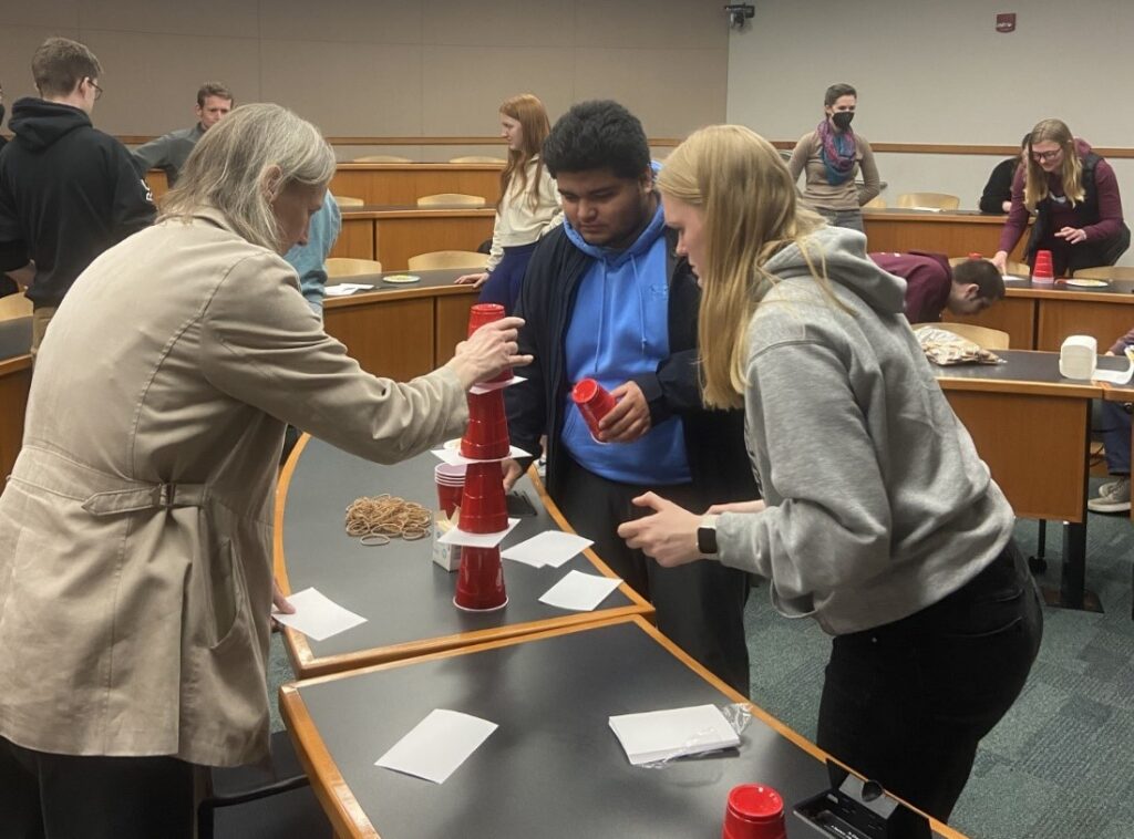 Photo of BMB faculty and students engaging in a "Minute to Win It" Challenge